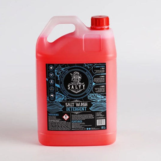 A red plastic container of Salty Captain Anti-Corrosion Salt Wash with a label featuring nautical elements.