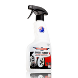 A bottle of Bowden's Own Sweet Rubber Tyre Shine with a spray nozzle, predominantly white with product information and branding.