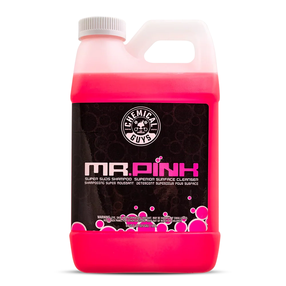 Pink bottle of 'Mr. Pink' surface cleaner with a white cap on a white background