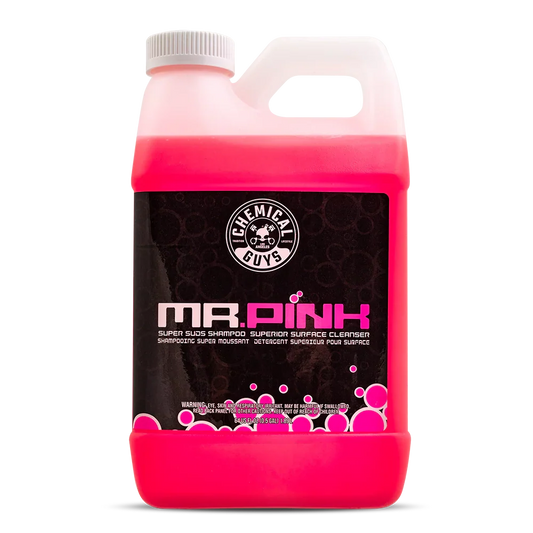 Pink bottle of 'Mr. Pink' surface cleaner with a white cap on a white background