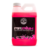 Pink bottle of 'Mr. Pink' surface cleaner with a white cap on a white background