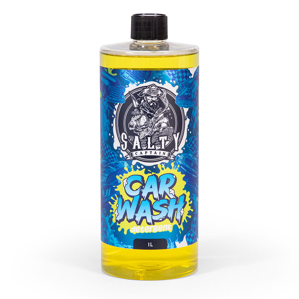 A bottle of Salty Captain Car Wash with a label featuring a cartoon character and a splash of blue and yellow colors.