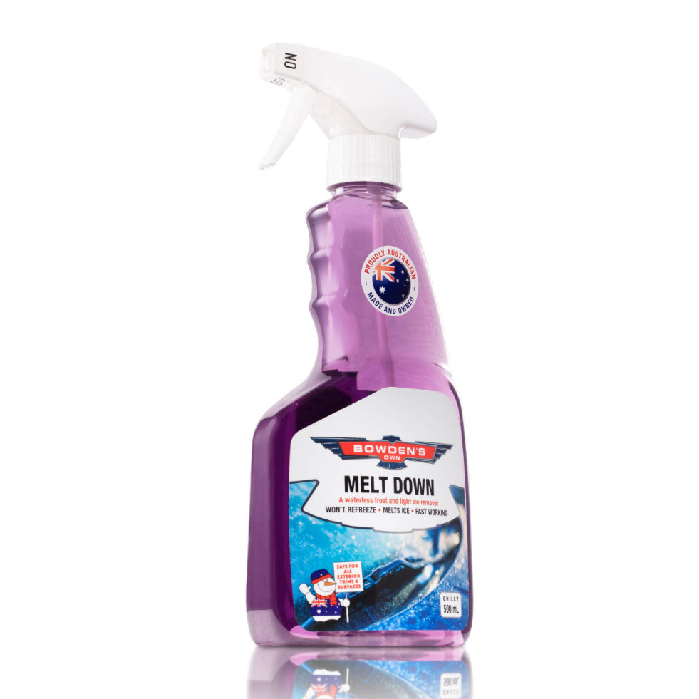 A purple spray bottle of Bowden's Own Melt Down ice remover with a label and white spray nozzle.