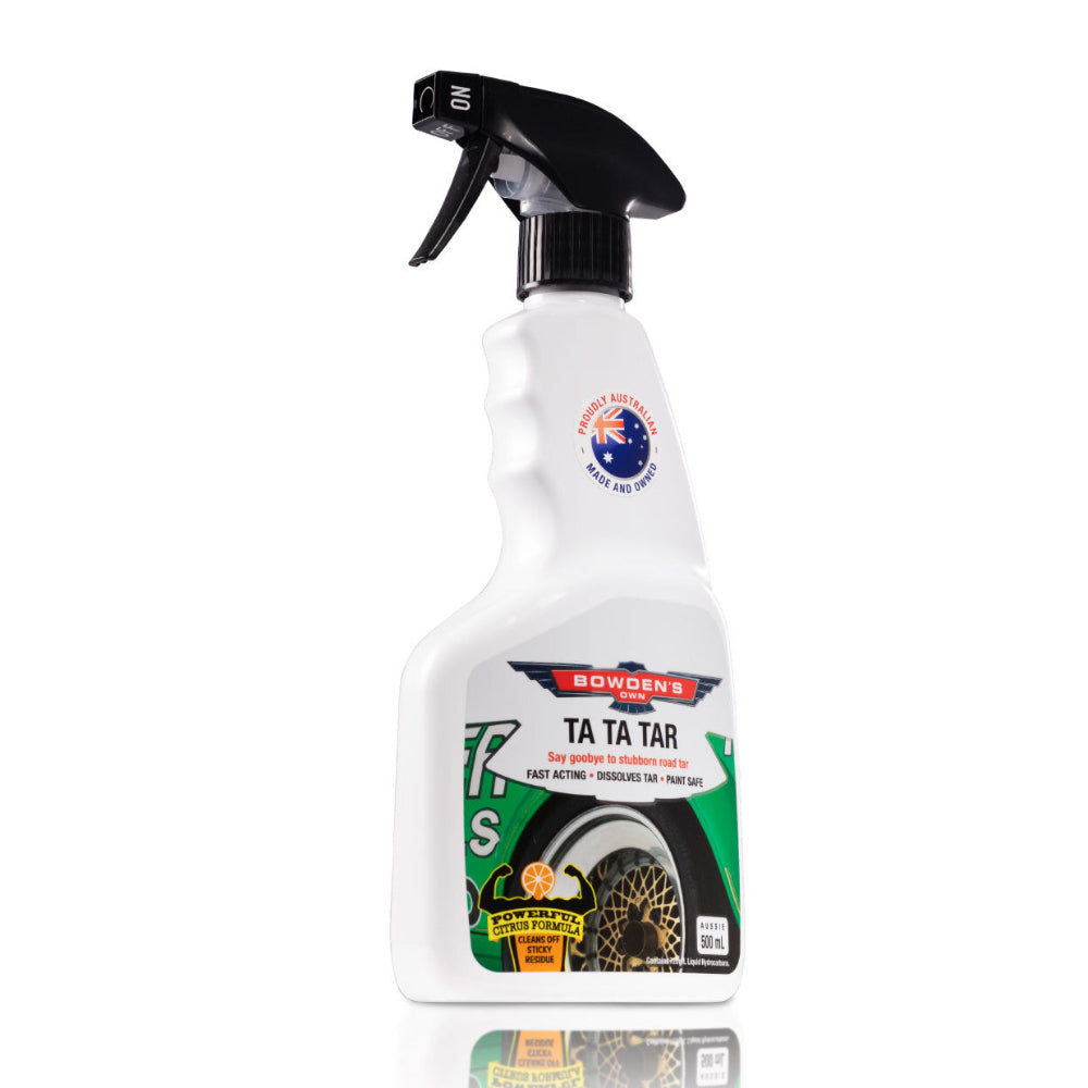 A white spray bottle with a label featuring the product name 'Ta Ta Tar' and an image of a car wheel, indicating its use for cleaning vehicle tar deposits.