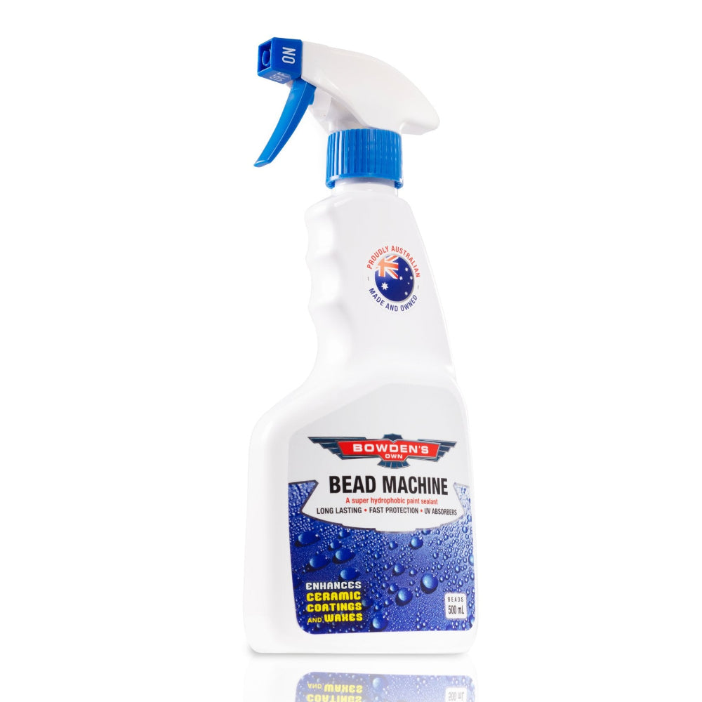A white spray bottle with blue and black text, labeled 'Bowden's Own Bead Machine 500ml' with images of water droplets on the label.
