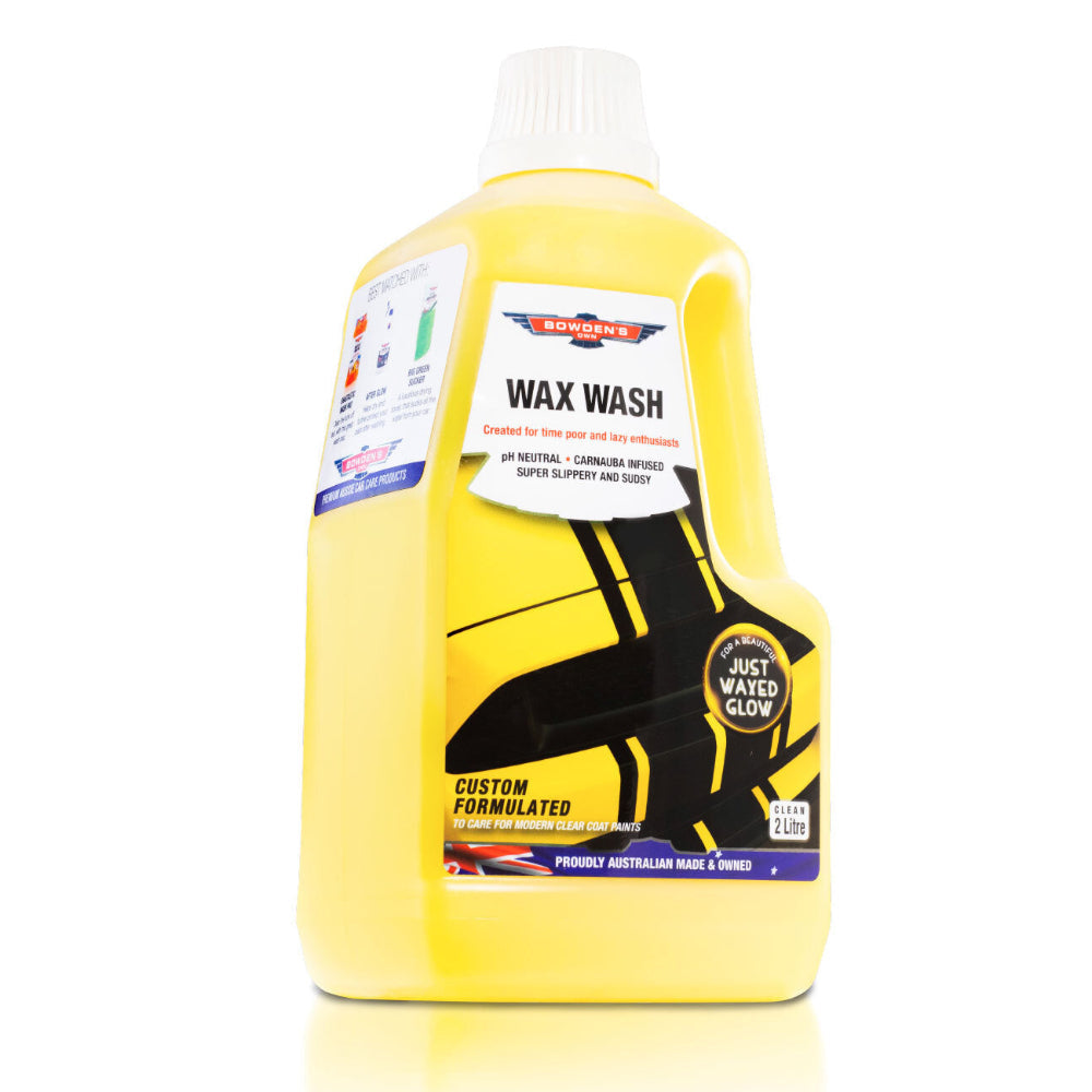A yellow plastic bottle of Bowden's Own Wax Wash with a label featuring product information. The bottle is 2 liters and has a non-drip cap.